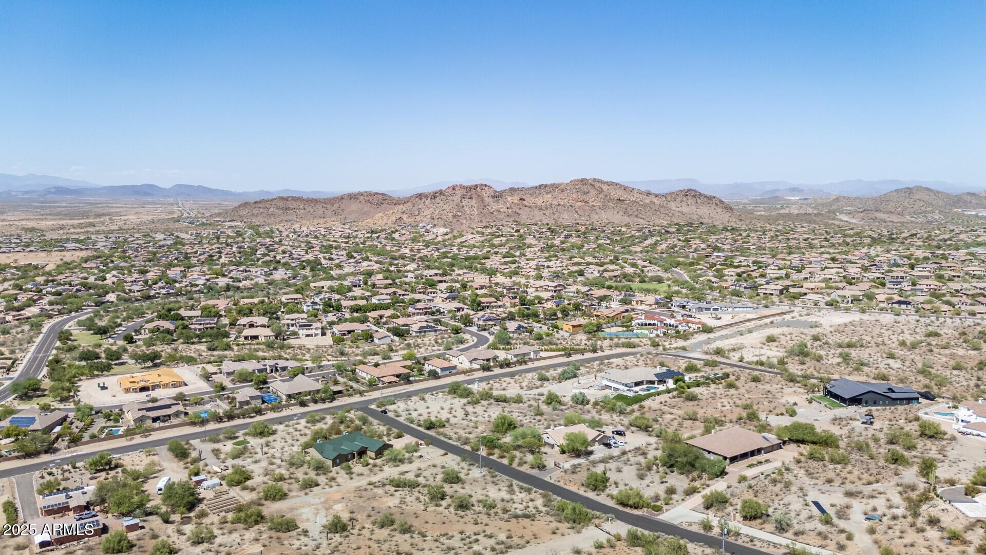 9303 West Briles Road, Unit 4 Peoria, AZ 85383 - Photo 20 of 20 an aerial view of residential house and mountains in the background