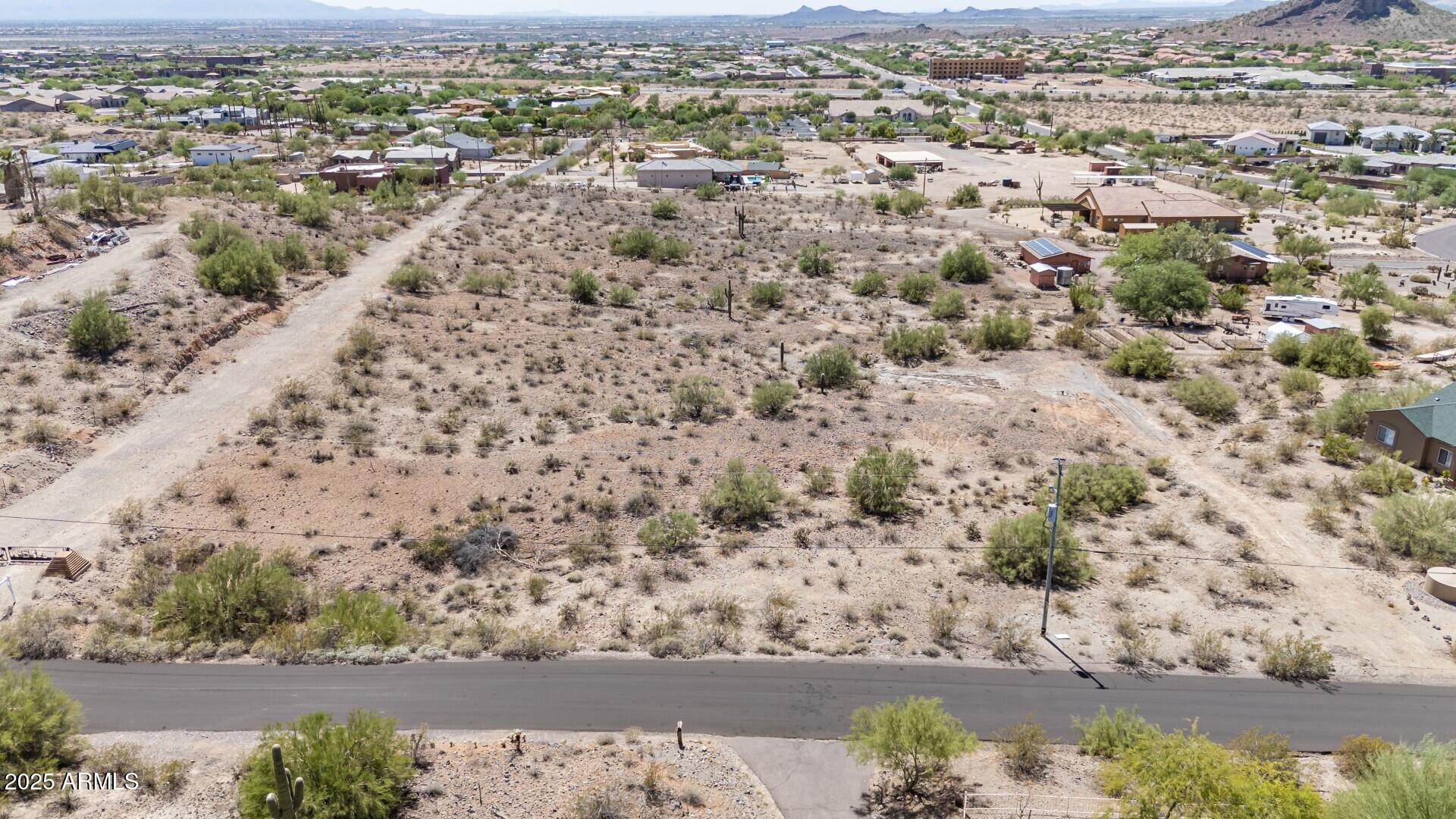 9303 West Briles Road, Unit 4 Peoria, AZ 85383 - Photo 3 of 20 an aerial view of a house with a yard