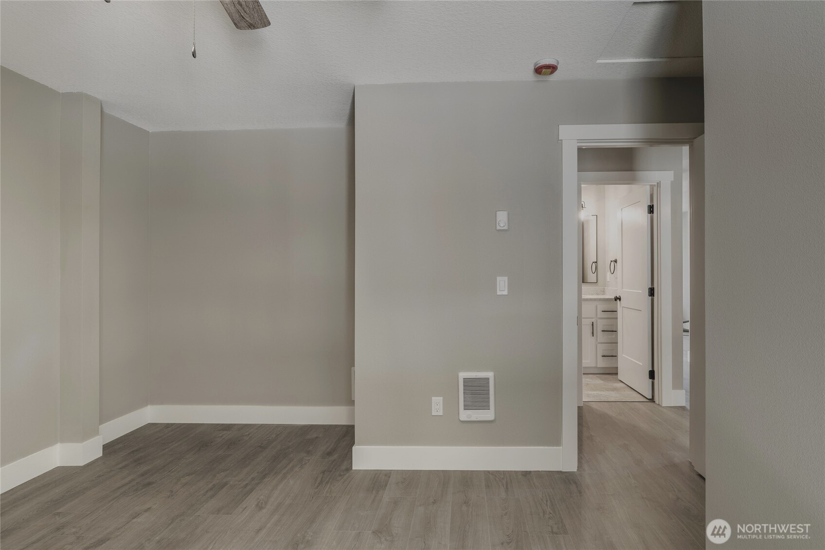 117 7th Street Southwest Long Beach, WA 98631 - Photo 12 of 25 a view of an empty room with wooden floor and closet