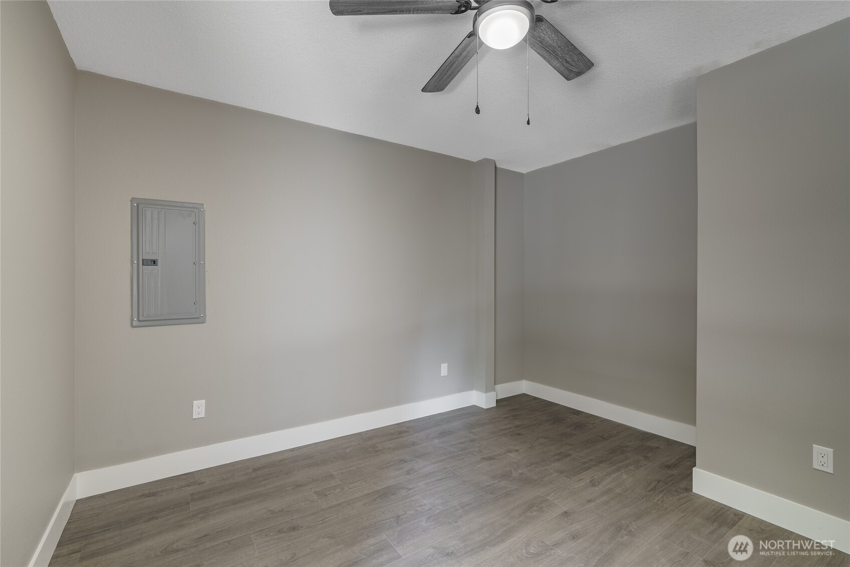 117 7th Street Southwest Long Beach, WA 98631 - Photo 14 of 25 a view of an empty room with a chandelier fan