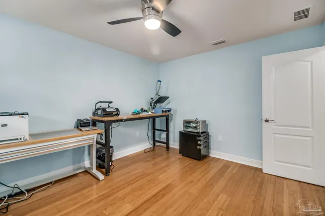 a room with furniture and wooden floor