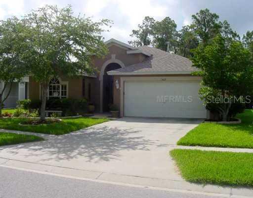 5608 Hawklake Road Lithia, FL 33547 - Photo 1 of 1 a front view of house with a garden