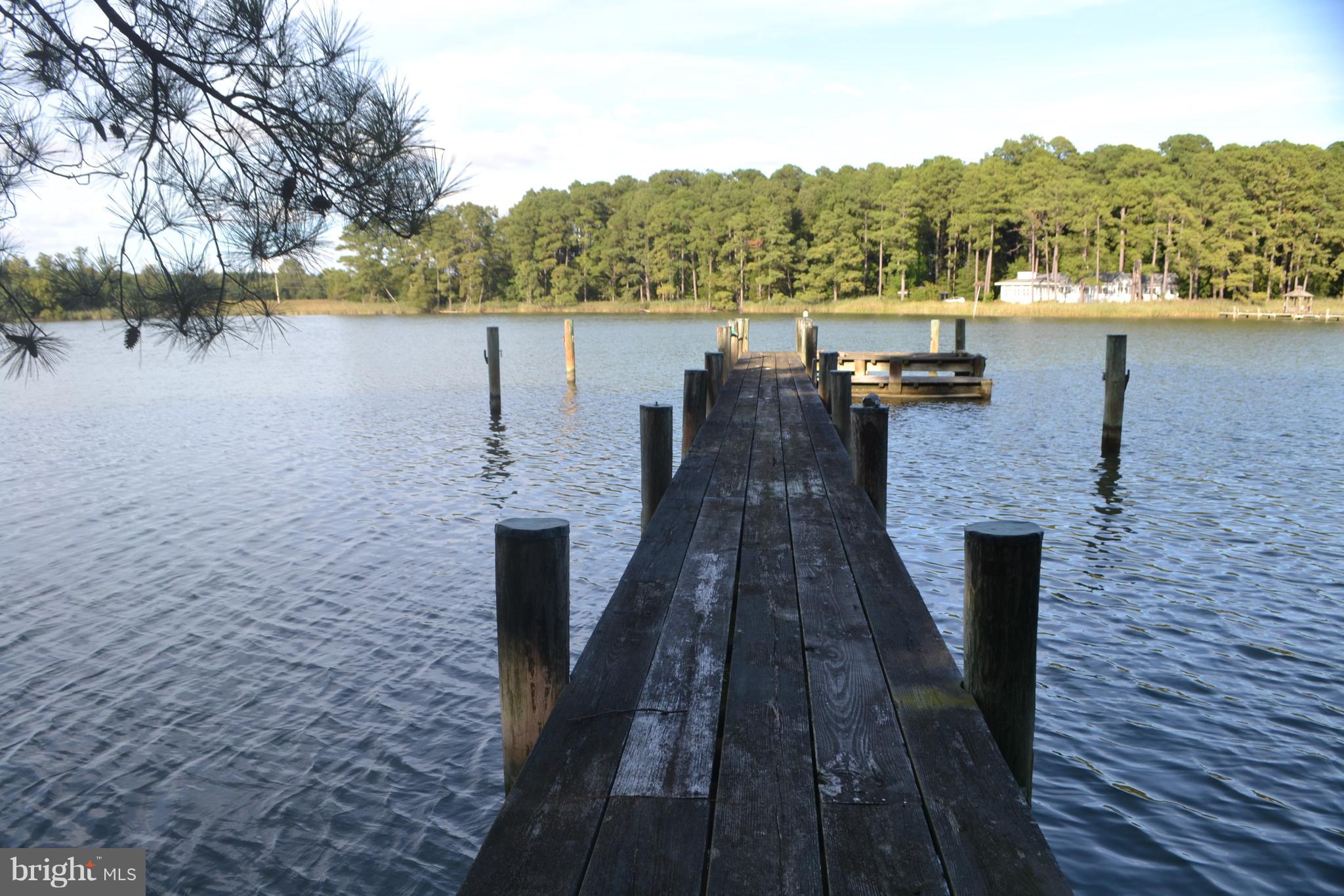 7223 Drum Point Road St. Michaels, MD 21663 - Photo 1 of 38 a view of a lake with a mountain view