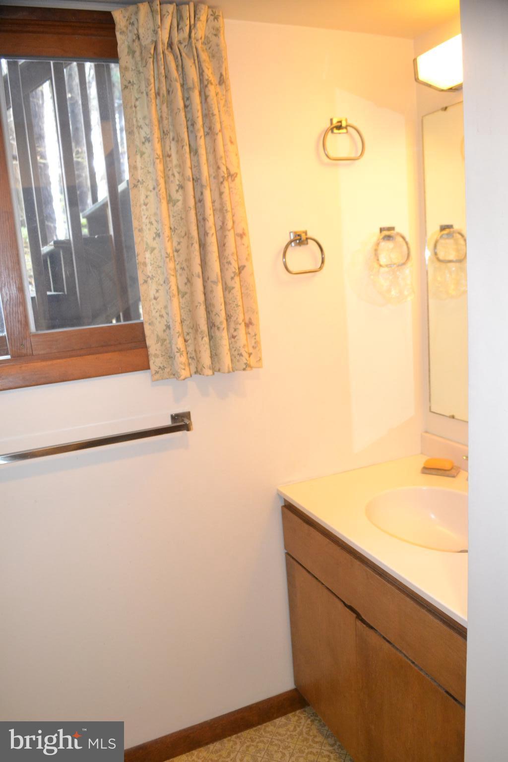7223 Drum Point Road St. Michaels, MD 21663 - Photo 21 of 38 a bathroom with a bathtub and a shower