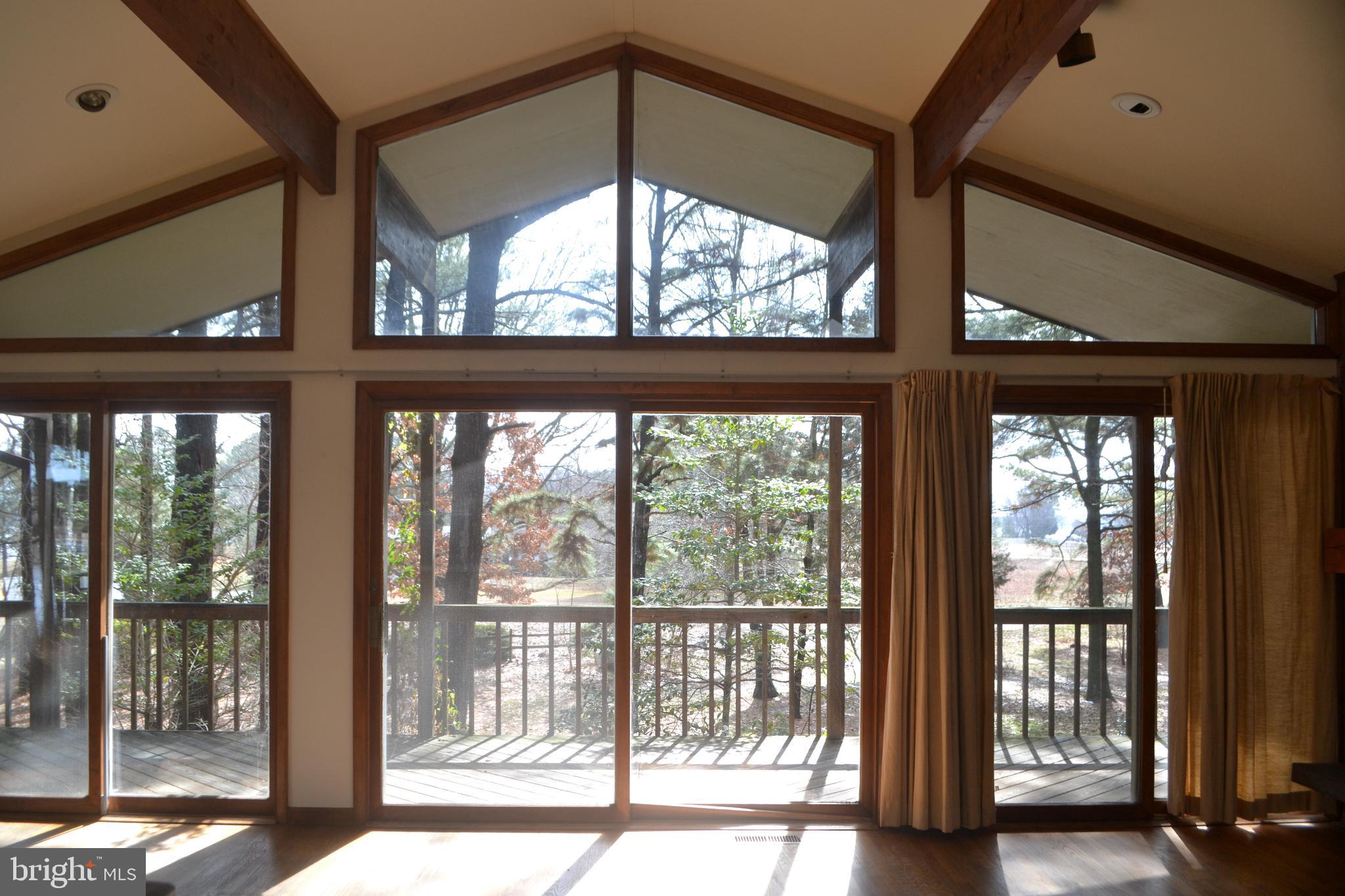 7223 Drum Point Road St. Michaels, MD 21663 - Photo 5 of 38 a view of a room with a large window
