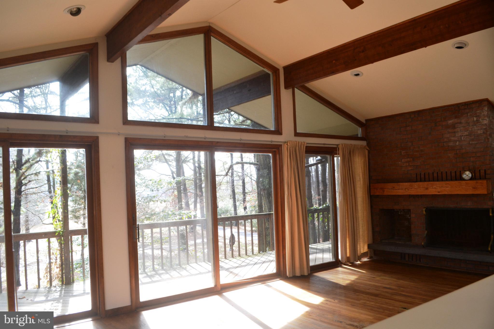 7223 Drum Point Road St. Michaels, MD 21663 - Photo 6 of 38 a view of front door and porch with wooden floor