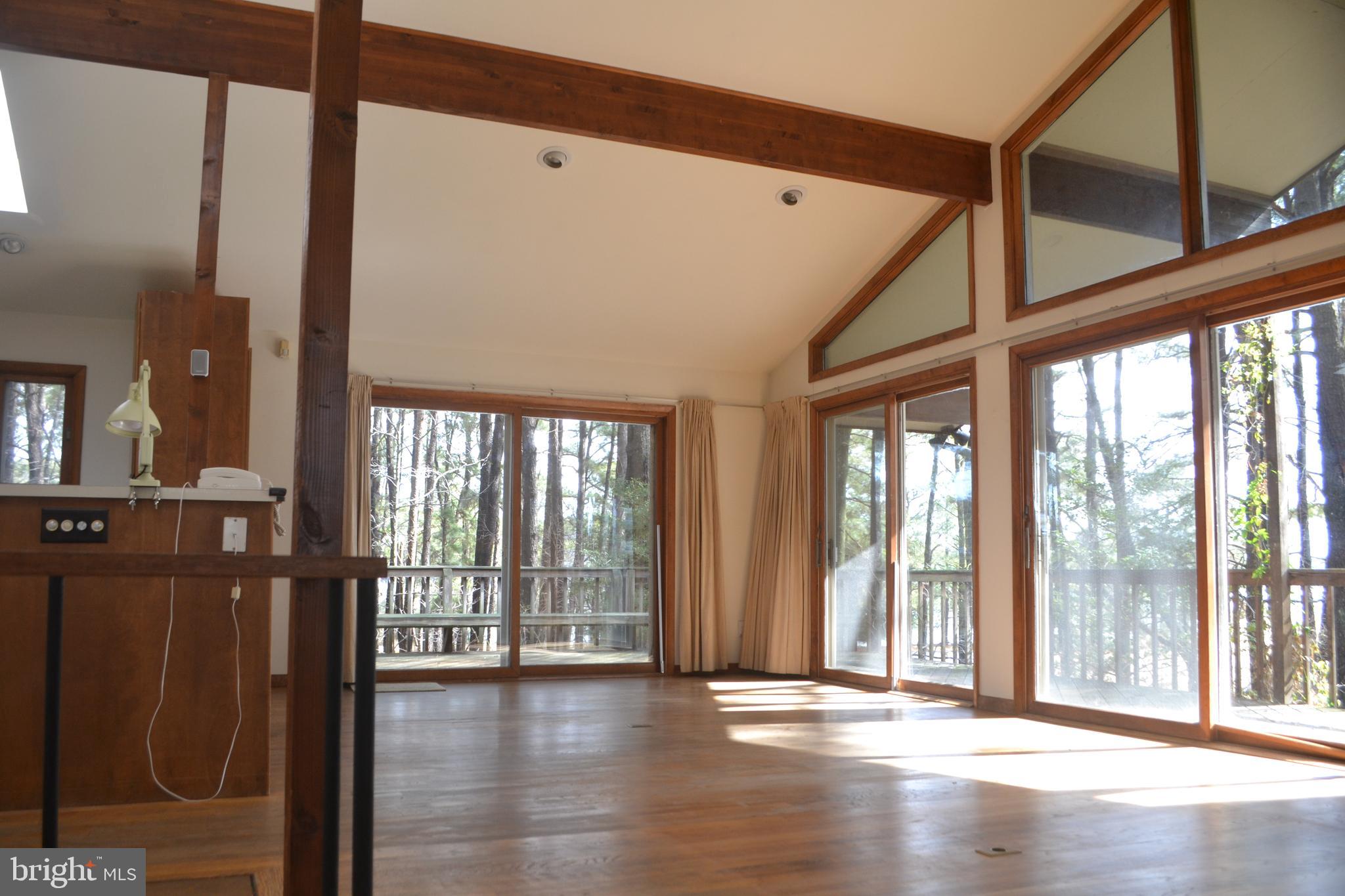 7223 Drum Point Road St. Michaels, MD 21663 - Photo 9 of 38 a view of an entryway with wooden floor