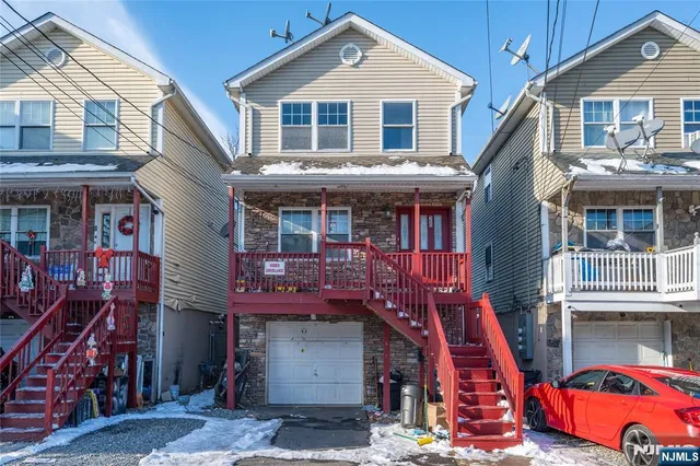 a front view of a houses on the street