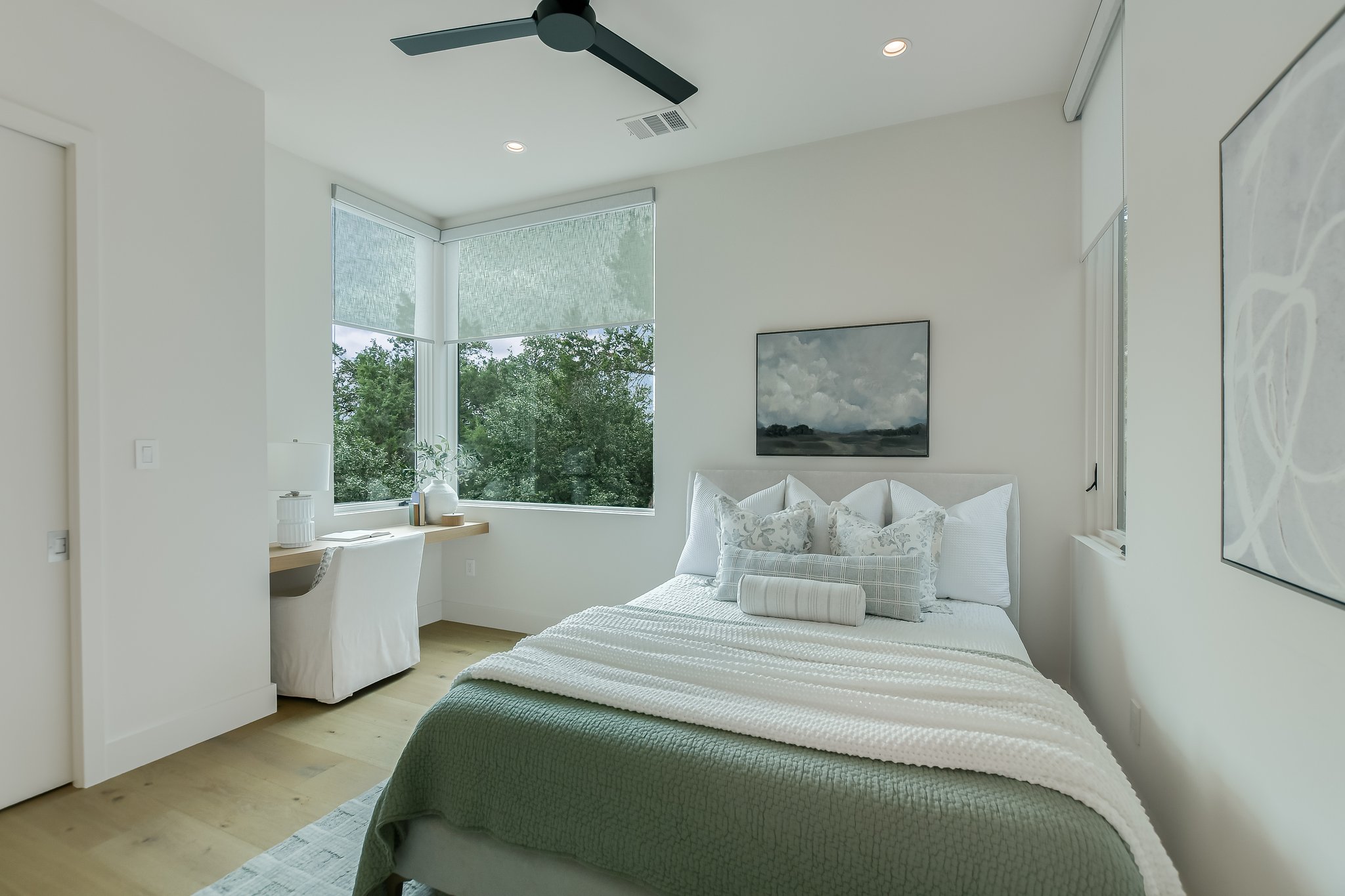 2405 Deer Pass Austin, TX 78746 - Photo 22 of 38 a bedroom with a large bed and a window