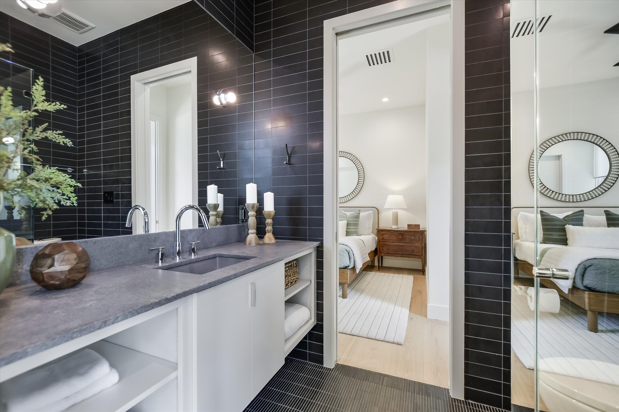 2405 Deer Pass Austin, TX 78746 - Photo 23 of 38 a en suite bathroom with a double vanity sink and a mirror