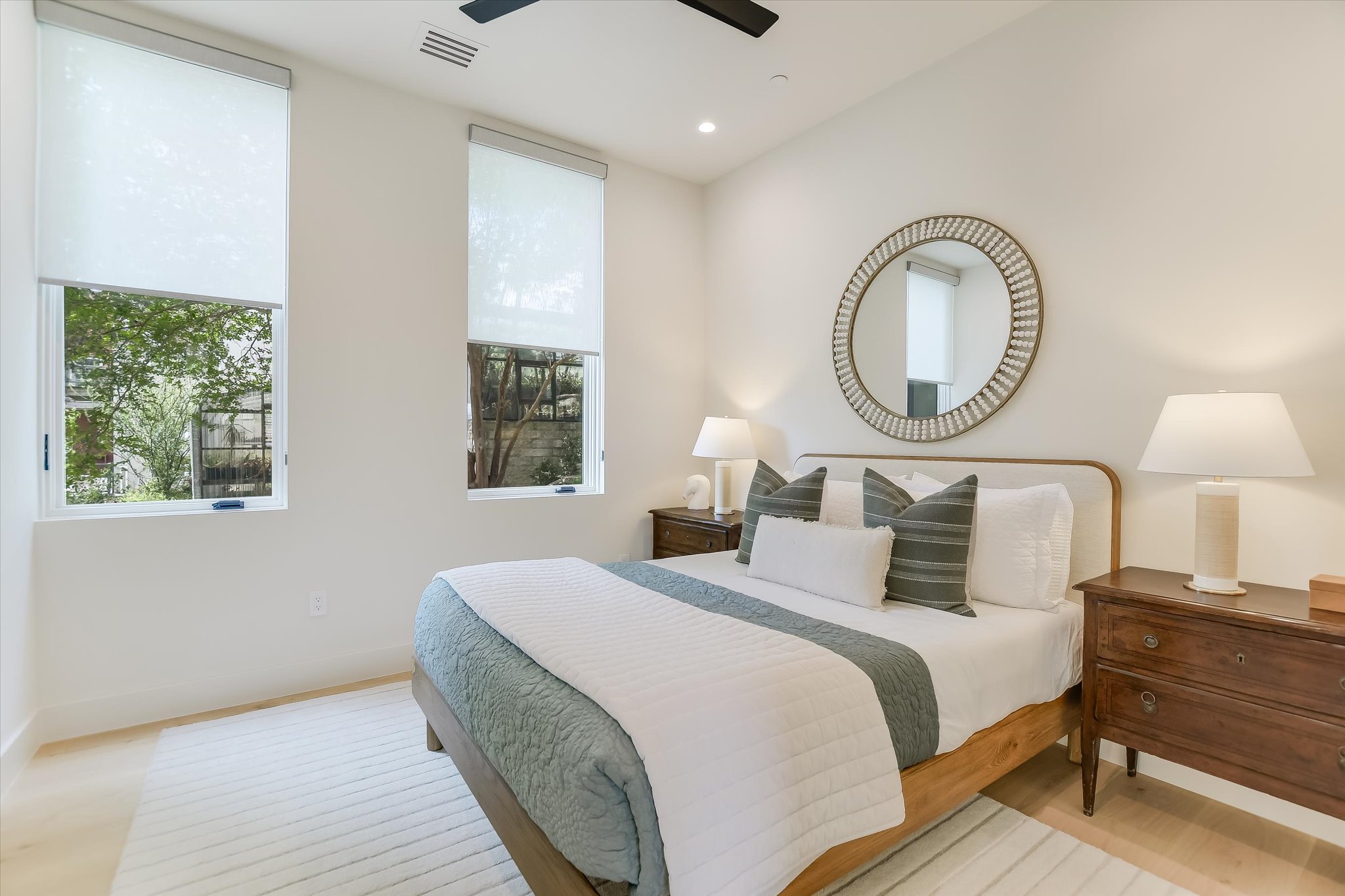 2405 Deer Pass Austin, TX 78746 - Photo 24 of 38 a bedroom with bed and a window