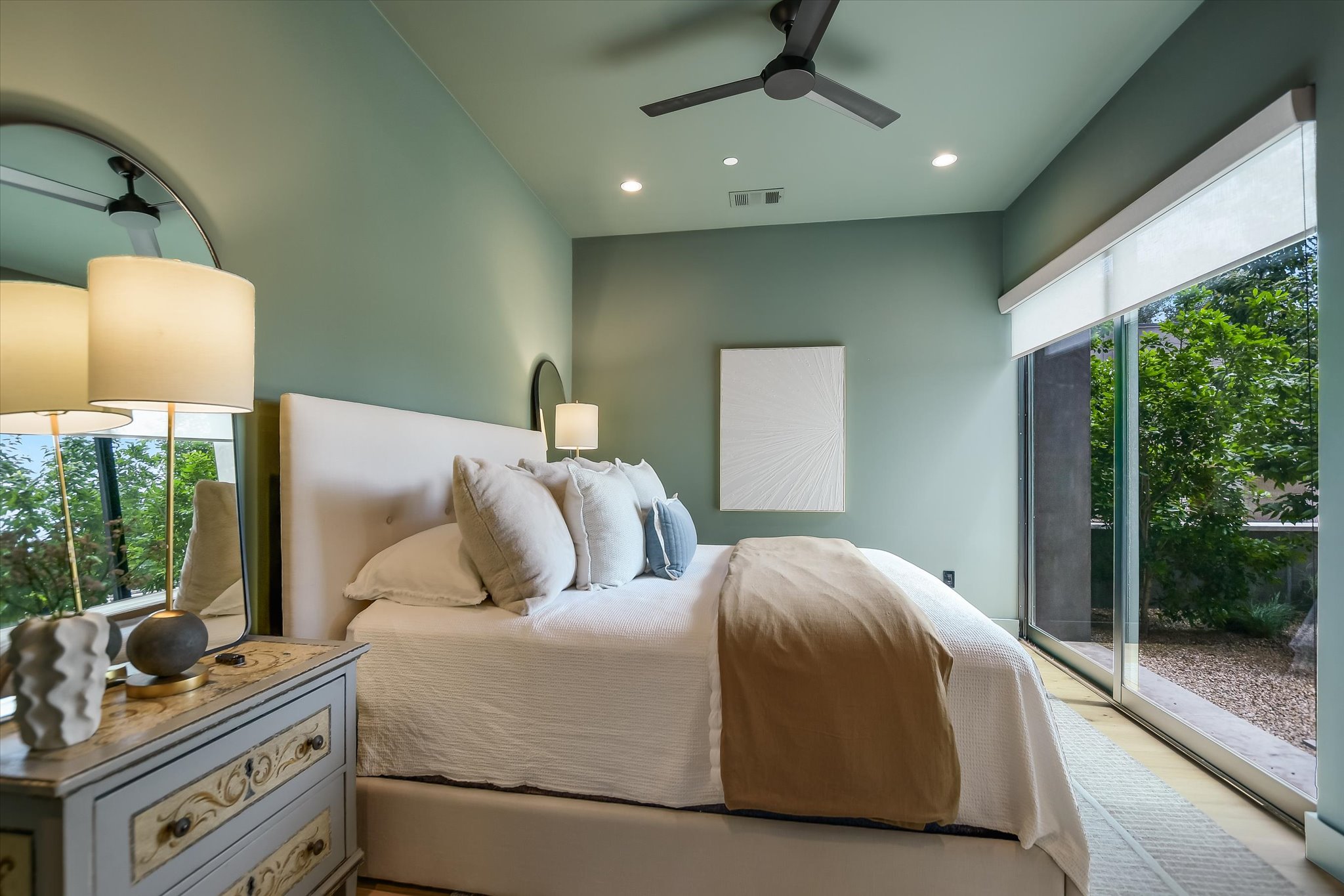 2405 Deer Pass Austin, TX 78746 - Photo 25 of 38 a bedroom with a bed and a window