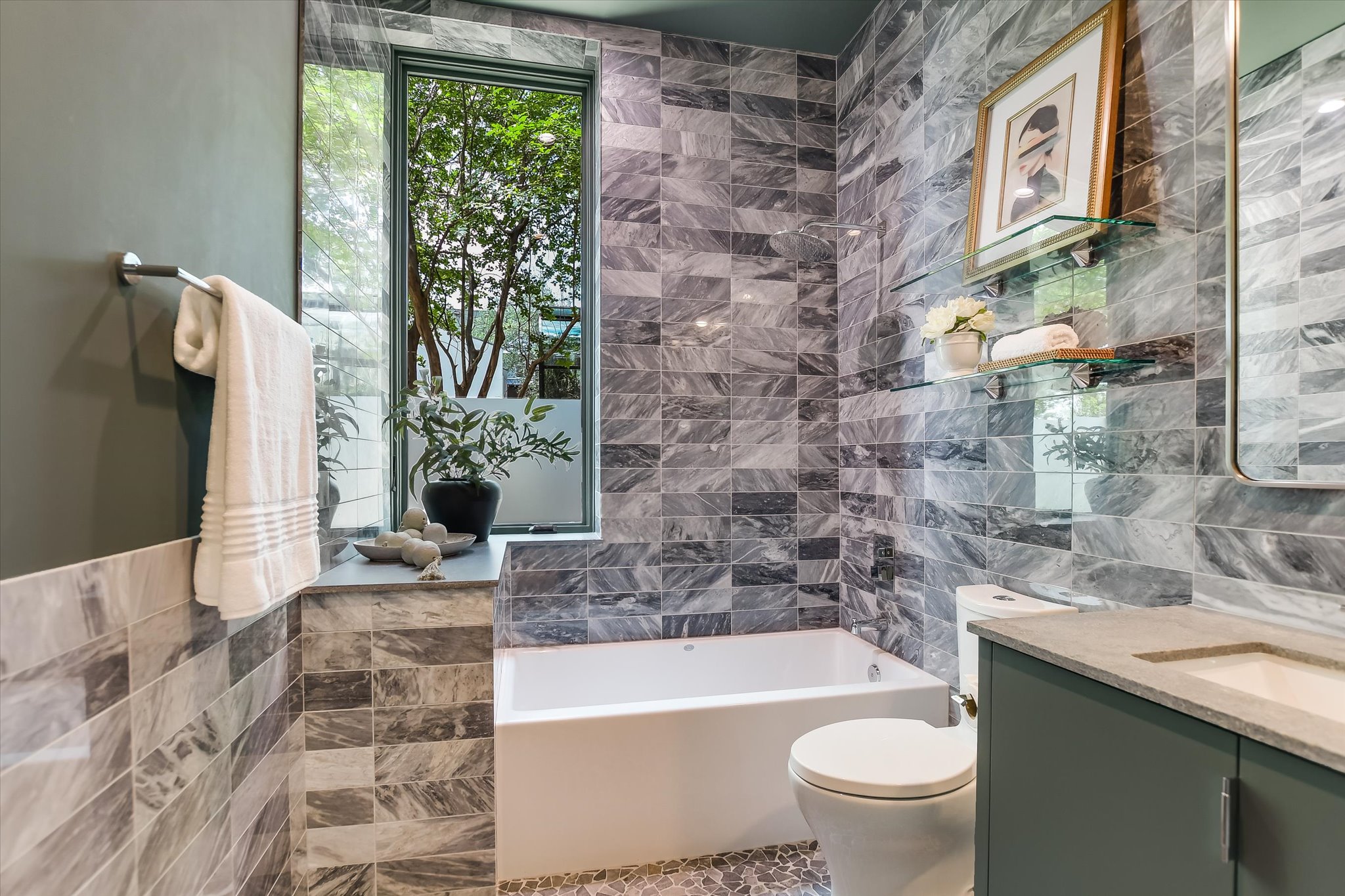 2405 Deer Pass Austin, TX 78746 - Photo 26 of 38 a bathroom with a bathtub and sink