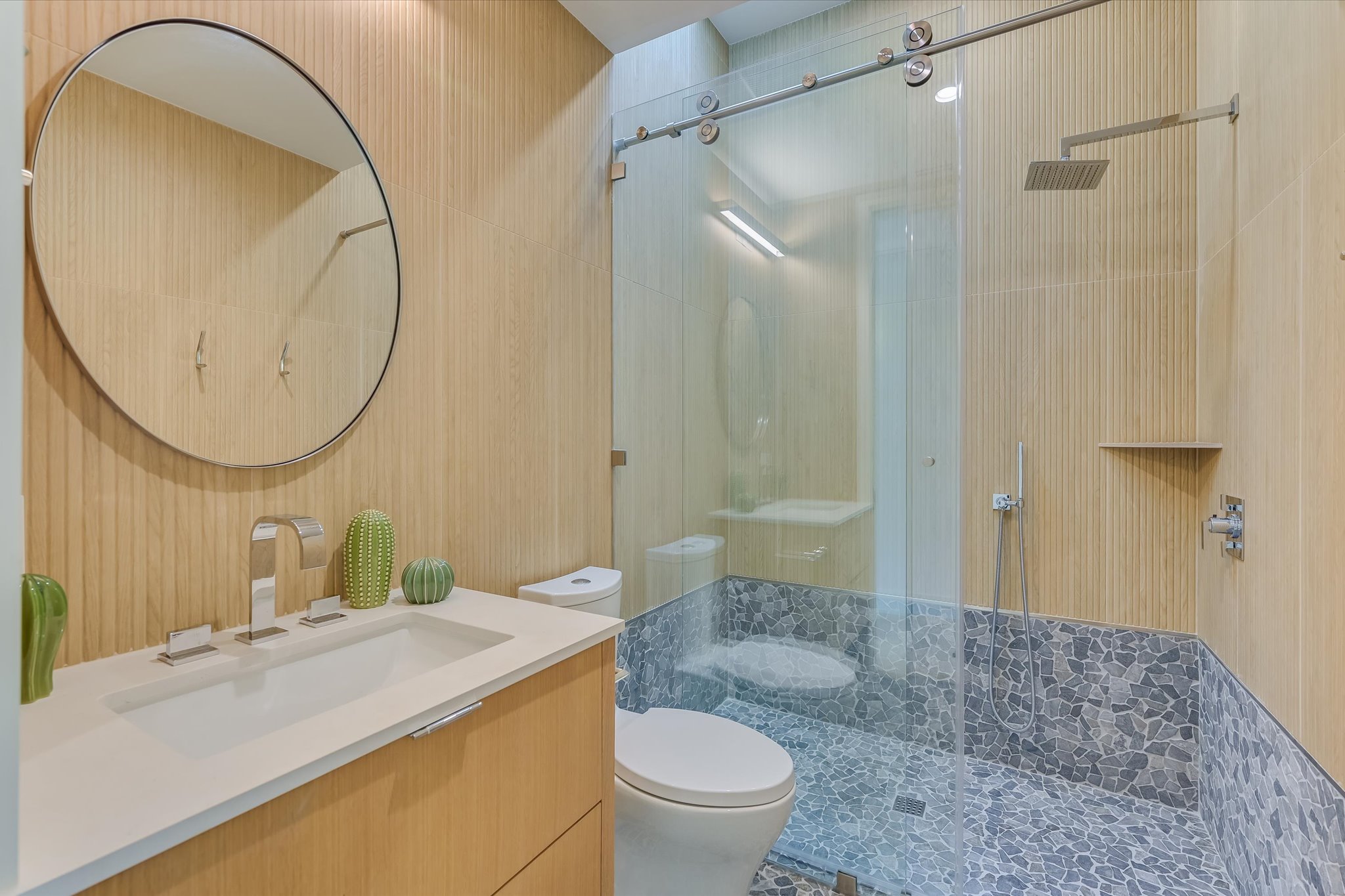 2405 Deer Pass Austin, TX 78746 - Photo 35 of 38 a bathroom with a sink a toilet and a mirror