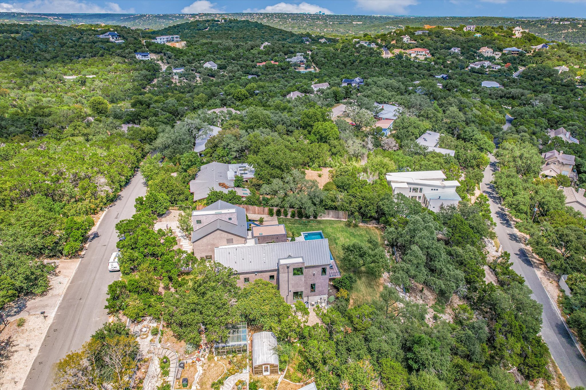 2405 Deer Pass Austin, TX 78746 - Photo 37 of 38 an aerial view of residential houses with outdoor space and trees