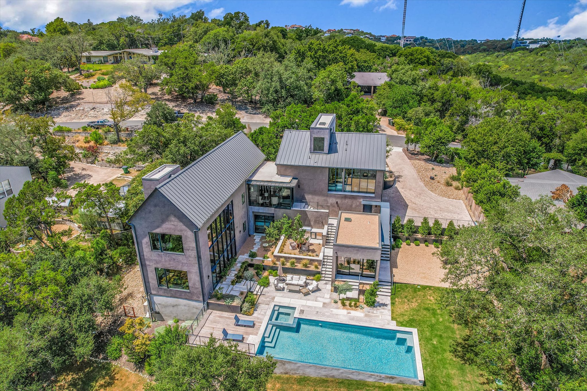 2405 Deer Pass Austin, TX 78746 - Photo 38 of 38 an aerial view of a house with a yard basket ball court and outdoor seating