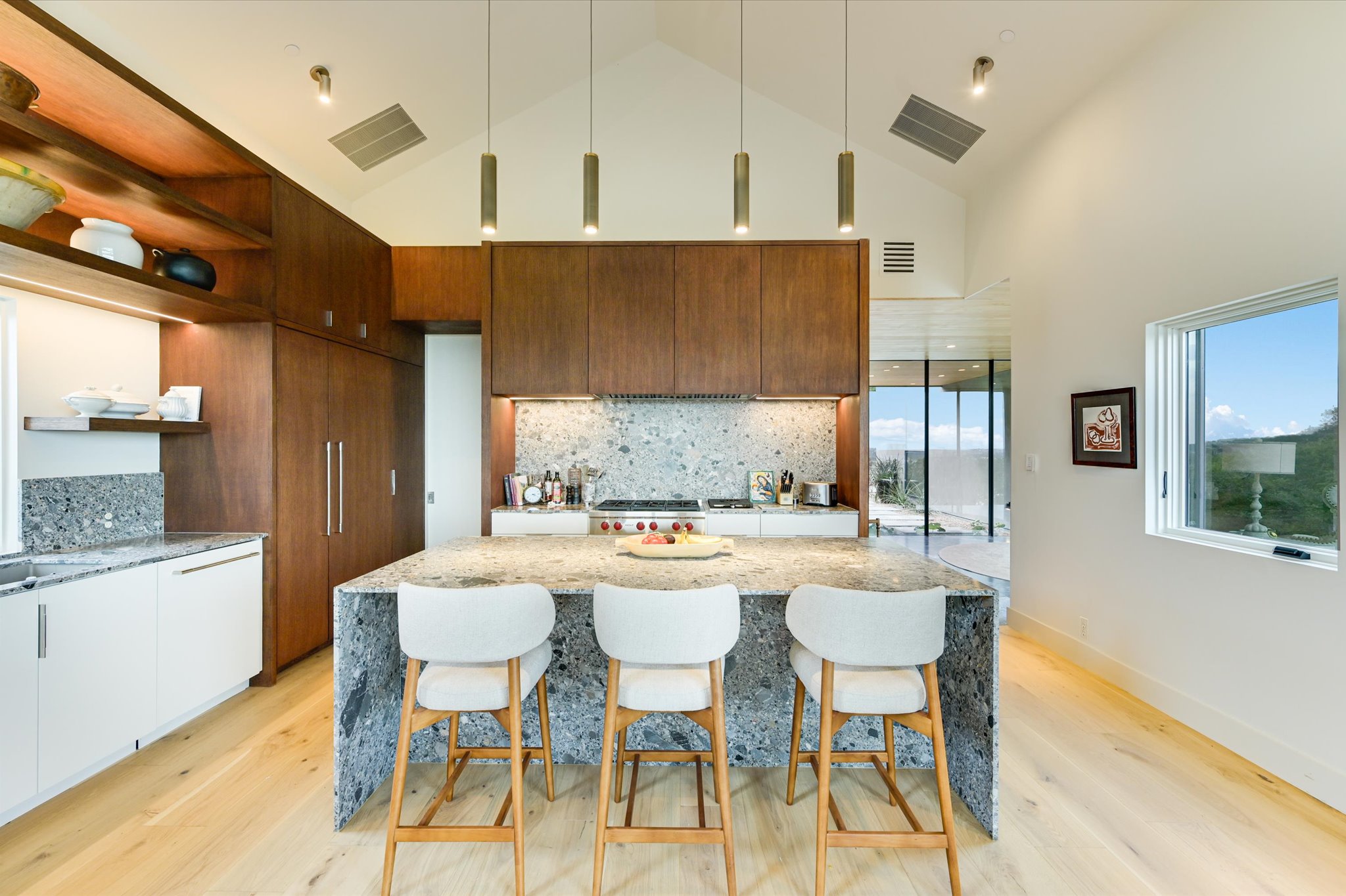 2405 Deer Pass Austin, TX 78746 - Photo 8 of 38 a kitchen with a table and chairs in it