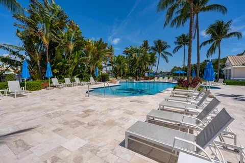 a view of a swimming pool with a patio