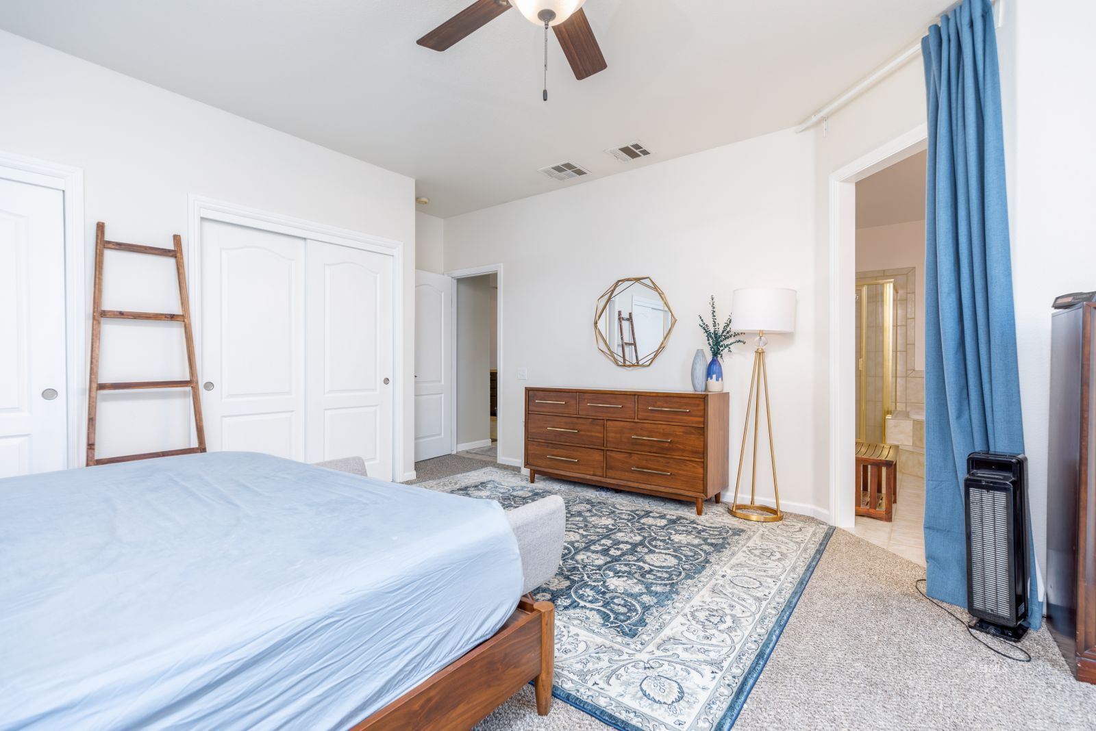 648 Pinon Court Ridgecrest, CA 93555 - Photo 18 of 35 a bedroom with a bed closet and flat screen tv