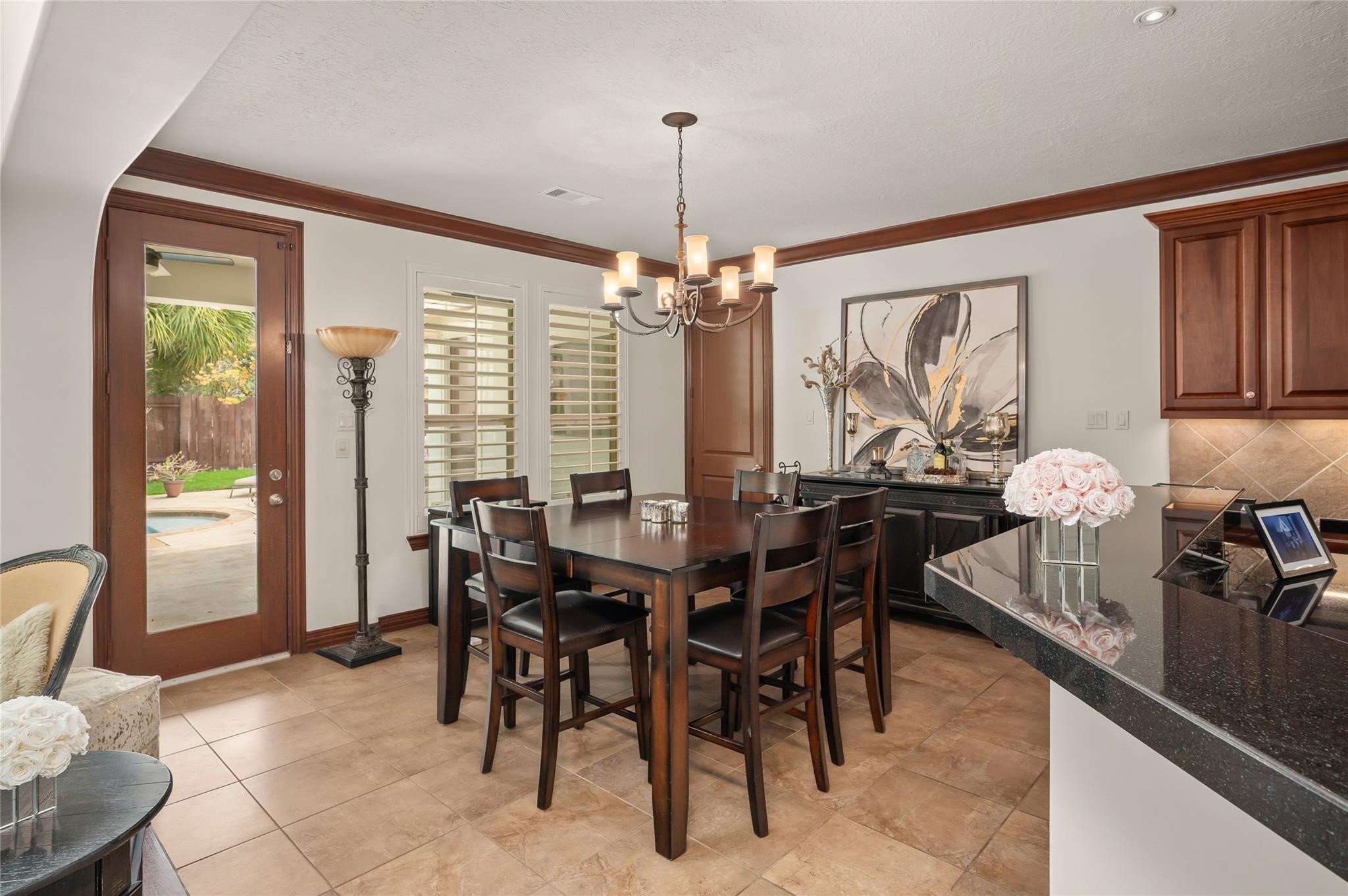 2127 Thicket Ridge Lane Houston, TX 77077 - Photo 17 of 50 The breakfast area is located between the door to the patio/pool, the kitchen and the first floor media room.