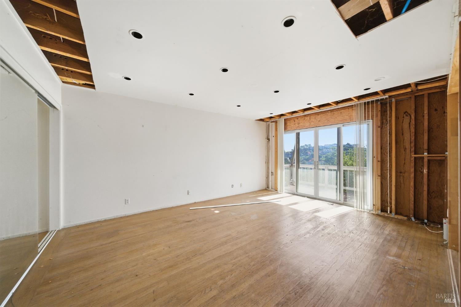 101 Round Hill Road Tiburon, CA 94920 - Photo 12 of 22 a view of an empty room with wooden floor and a window