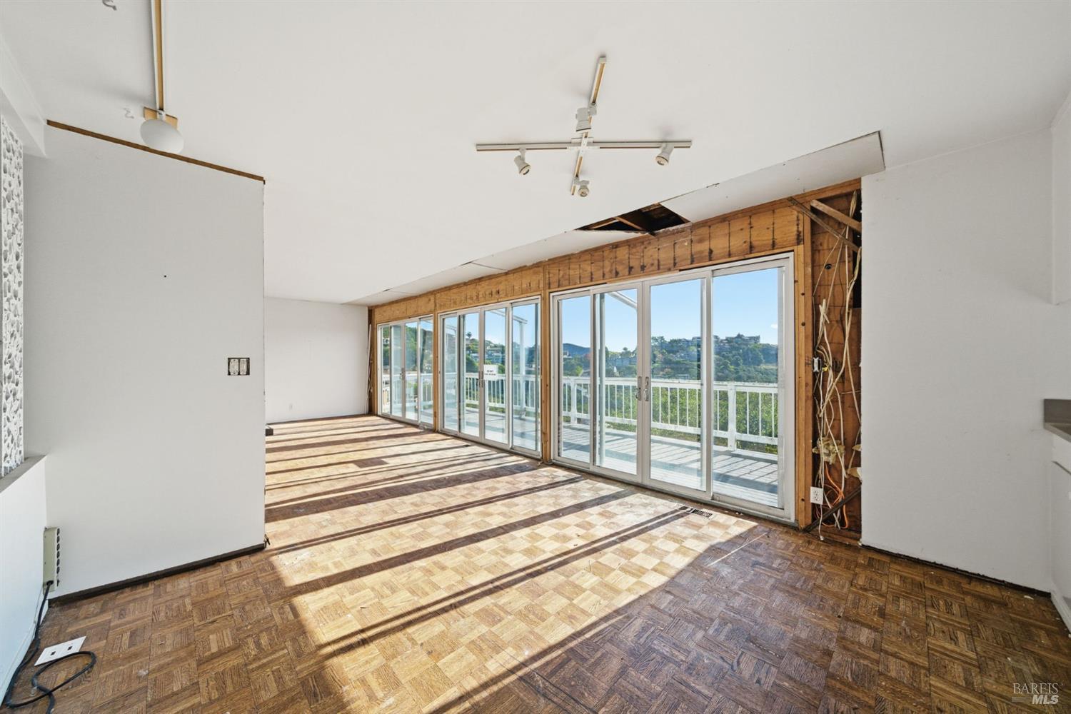 101 Round Hill Road Tiburon, CA 94920 - Photo 6 of 22 a view of a bedroom with wooden floor and windows