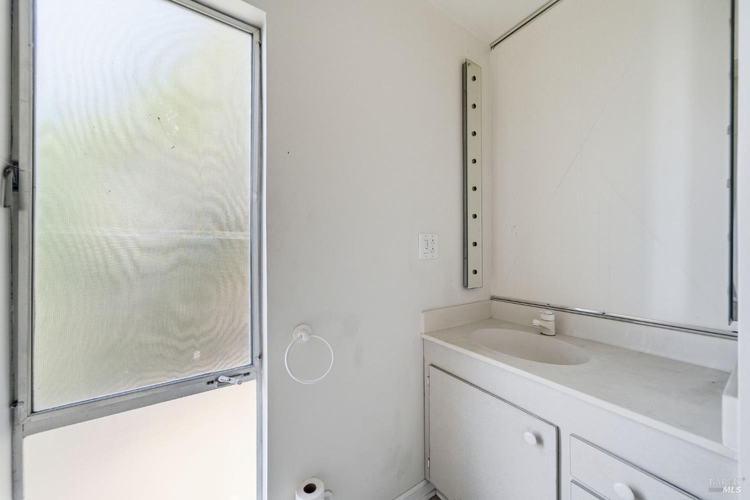101 Round Hill Road Tiburon, CA 94920 - Photo 10 of 22 a bathroom with a sink and a mirror