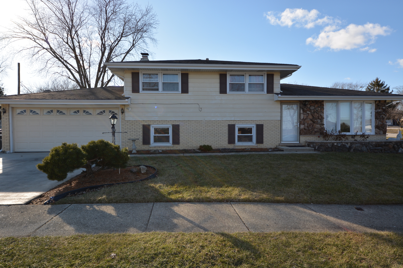 8029 West 90th Street Hickory Hills, IL 60457 - Photo 1 of 23 a front view of a house with garden