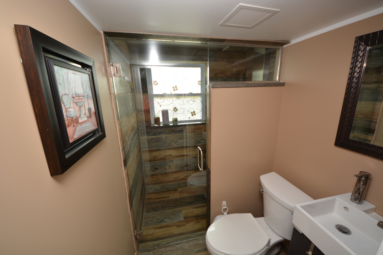 8029 West 90th Street Hickory Hills, IL 60457 - Photo 12 of 23 a bathroom with a toilet a sink and mirror