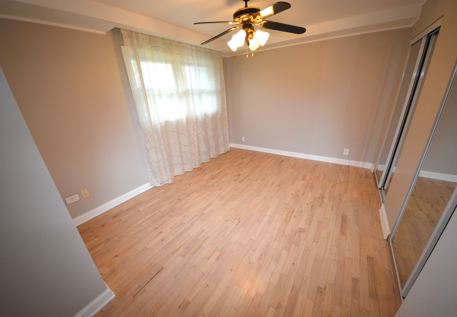 8029 West 90th Street Hickory Hills, IL 60457 - Photo 18 of 23 wooden floor in an empty room with a window