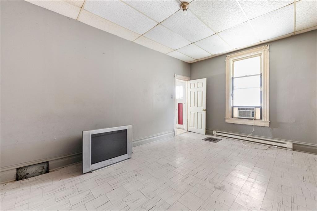 303 Agnew Road Jeannette, PA 15644 - Photo 13 of 28 an empty room with windows