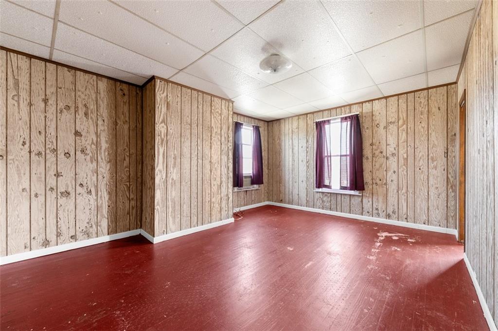 303 Agnew Road Jeannette, PA 15644 - Photo 16 of 28 wooden floor in an empty room with a window