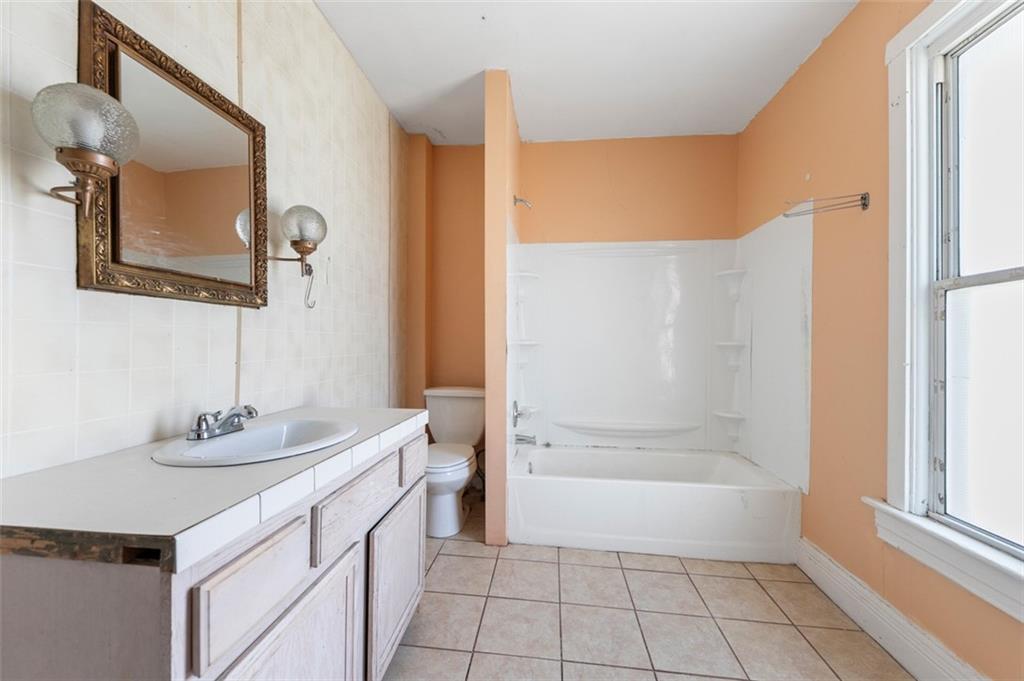 303 Agnew Road Jeannette, PA 15644 - Photo 18 of 28 a bathroom with a sink a toilet and shower