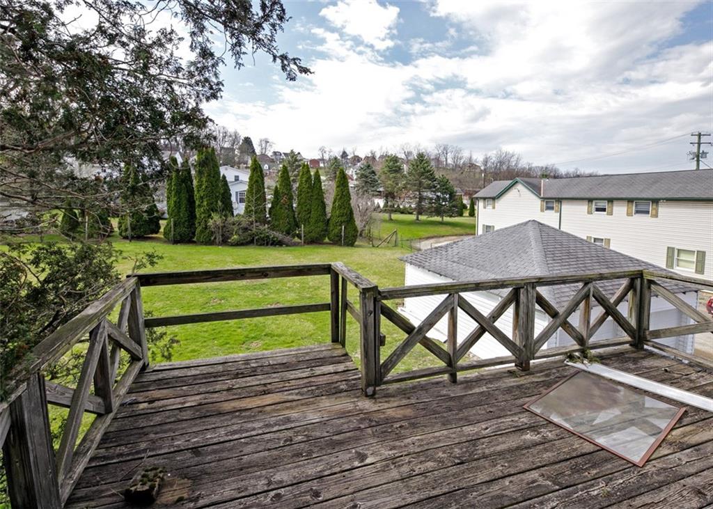 303 Agnew Road Jeannette, PA 15644 - Photo 22 of 28 a view of a wooden chairs and table on the wooden floor