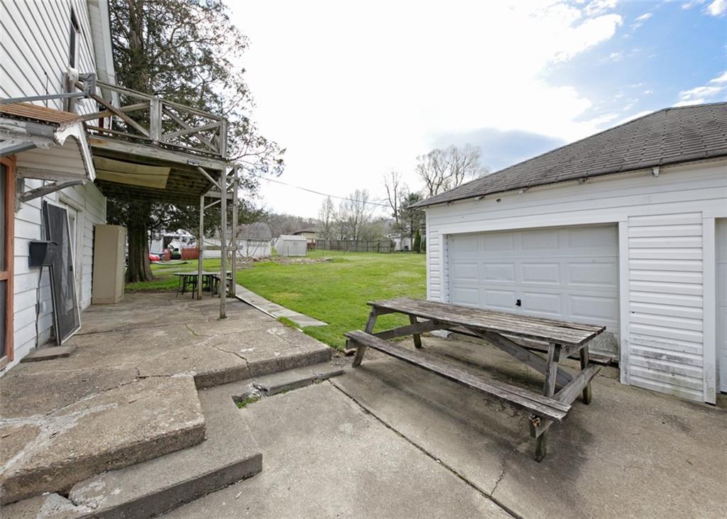 303 Agnew Road Jeannette, PA 15644 - Photo 26 of 28 a view of a backyard with sitting area