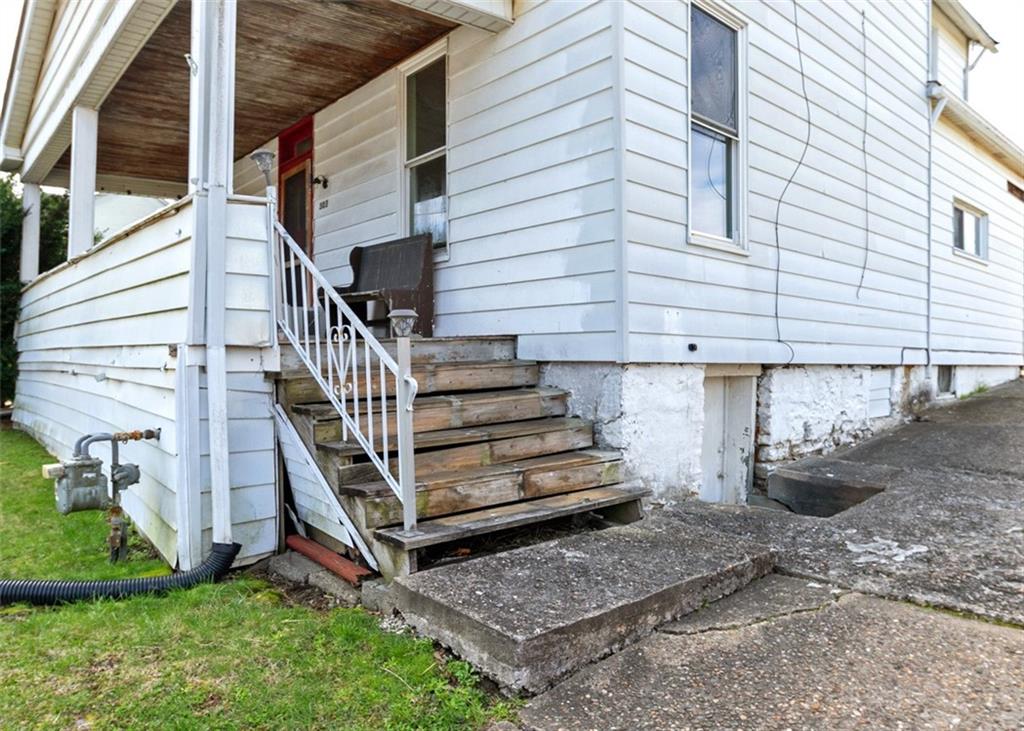 303 Agnew Road Jeannette, PA 15644 - Photo 3 of 28 front view of a house with a yard