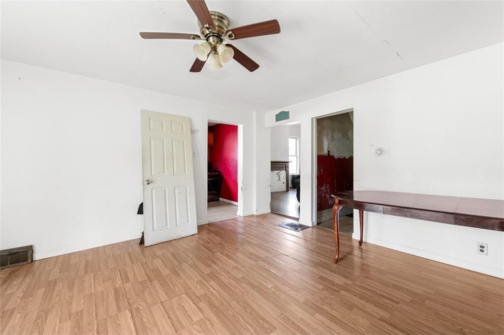 303 Agnew Road Jeannette, PA 15644 - Photo 7 of 28 a view of empty room with wooden floor