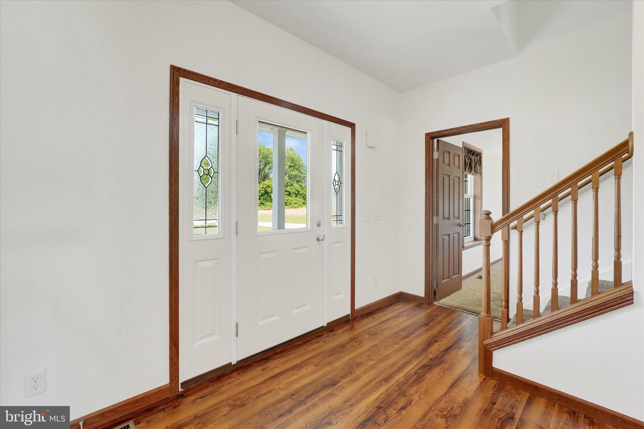 249 Floral Way Rising Sun, MD 21911 - Photo 20 of 65 a view of an empty room with wooden floor and a window