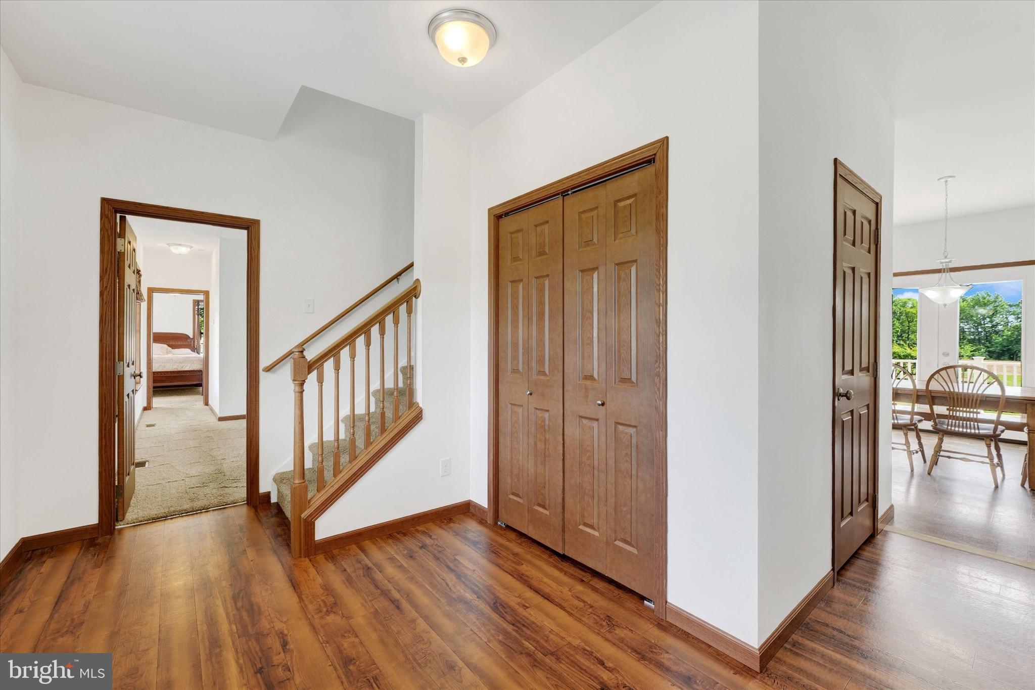 249 Floral Way Rising Sun, MD 21911 - Photo 21 of 65 a view of a hallway with wooden floor and stairs