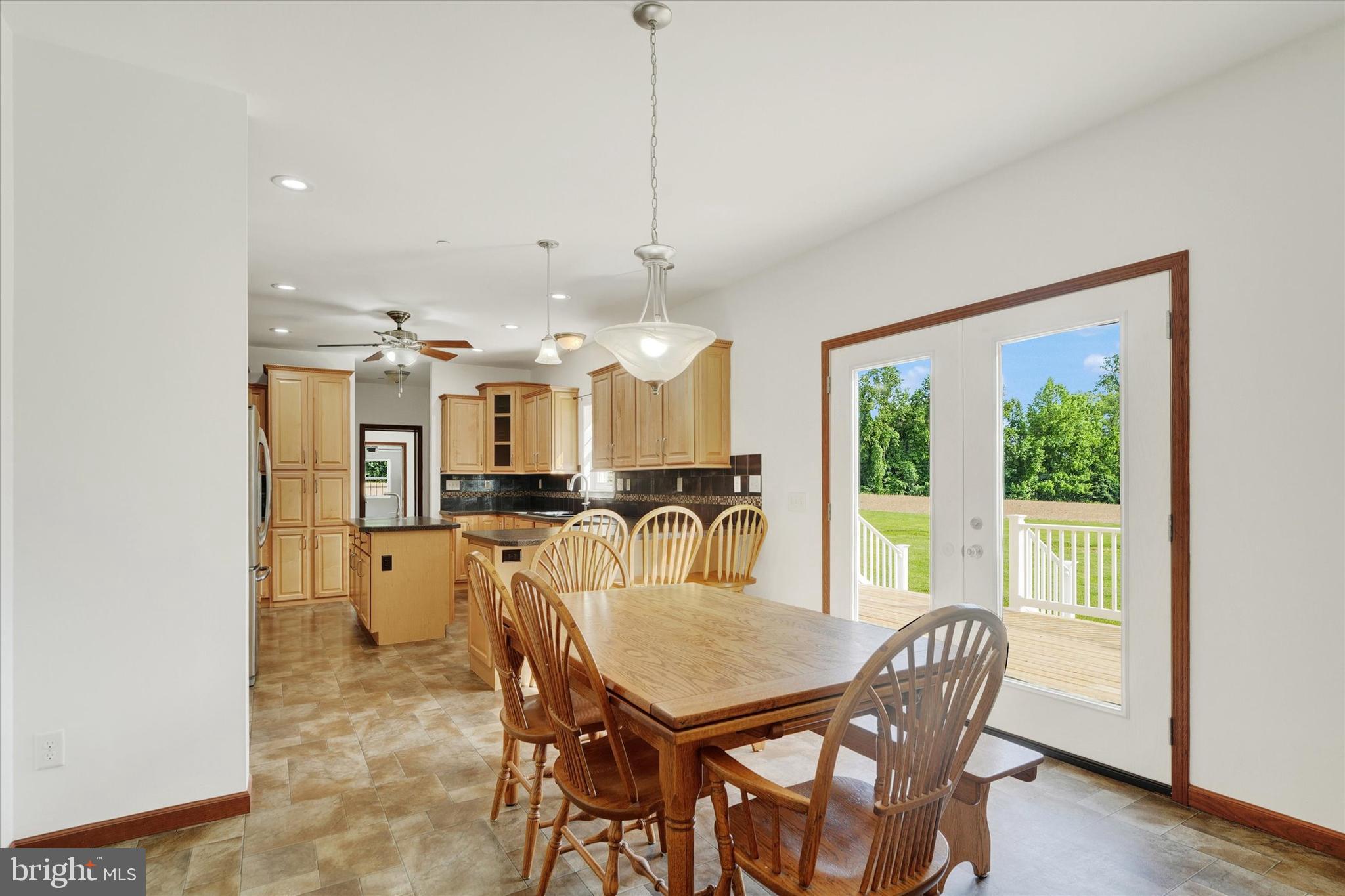 249 Floral Way Rising Sun, MD 21911 - Photo 27 of 65 a dining room with stainless steel appliances furniture a window and kitchen view