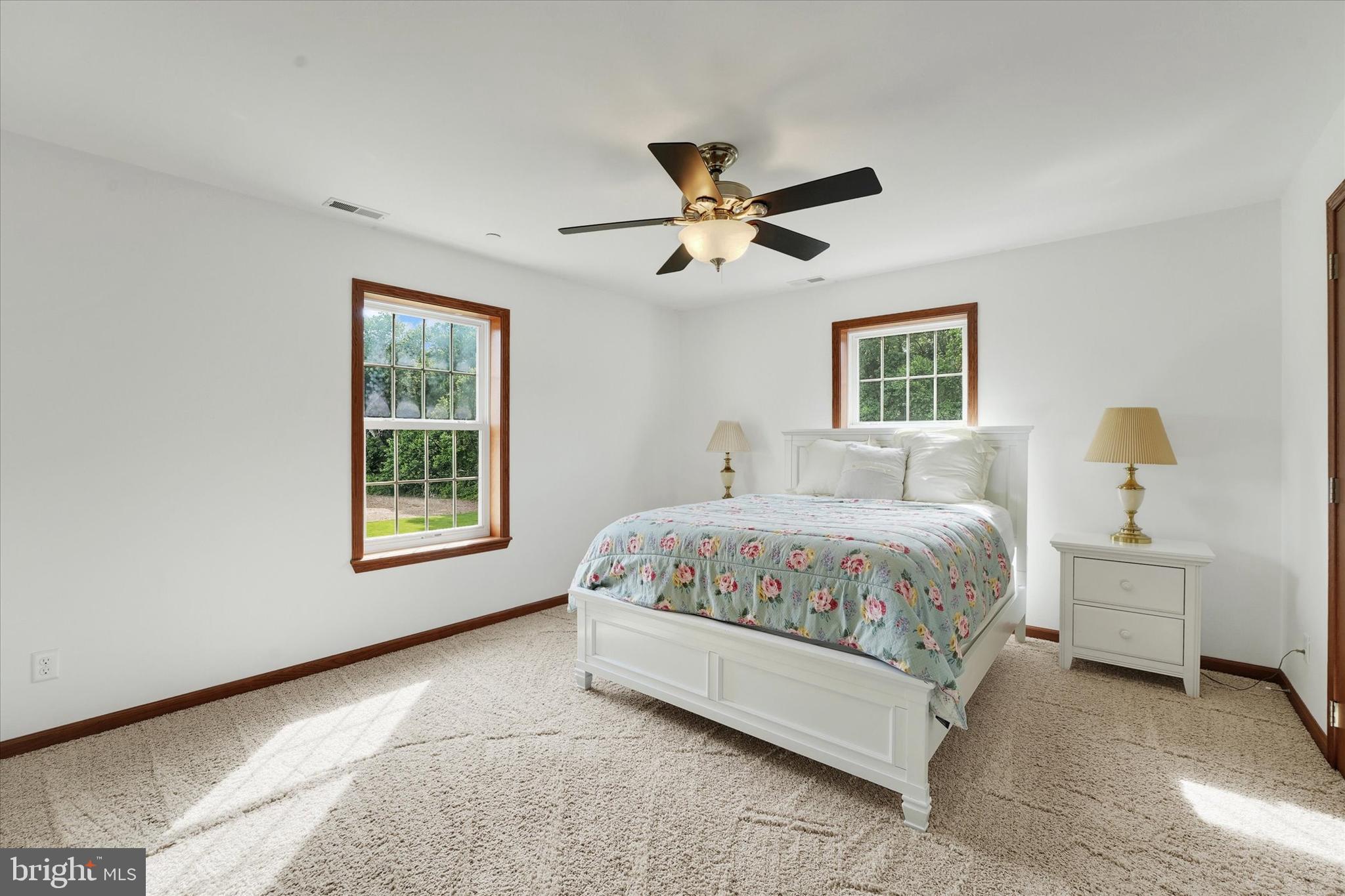 249 Floral Way Rising Sun, MD 21911 - Photo 42 of 65 a spacious bedroom with a bed and a window