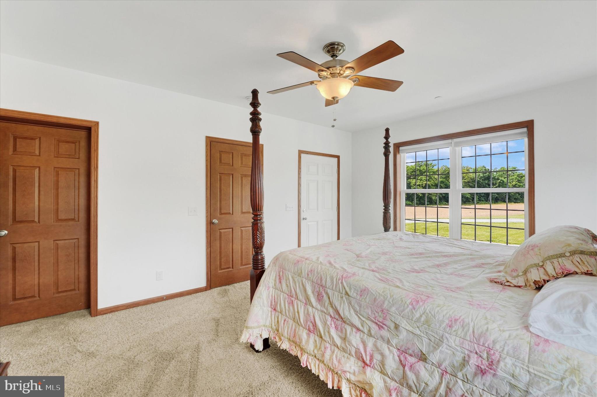 249 Floral Way Rising Sun, MD 21911 - Photo 44 of 65 a bedroom with a large bed and a window