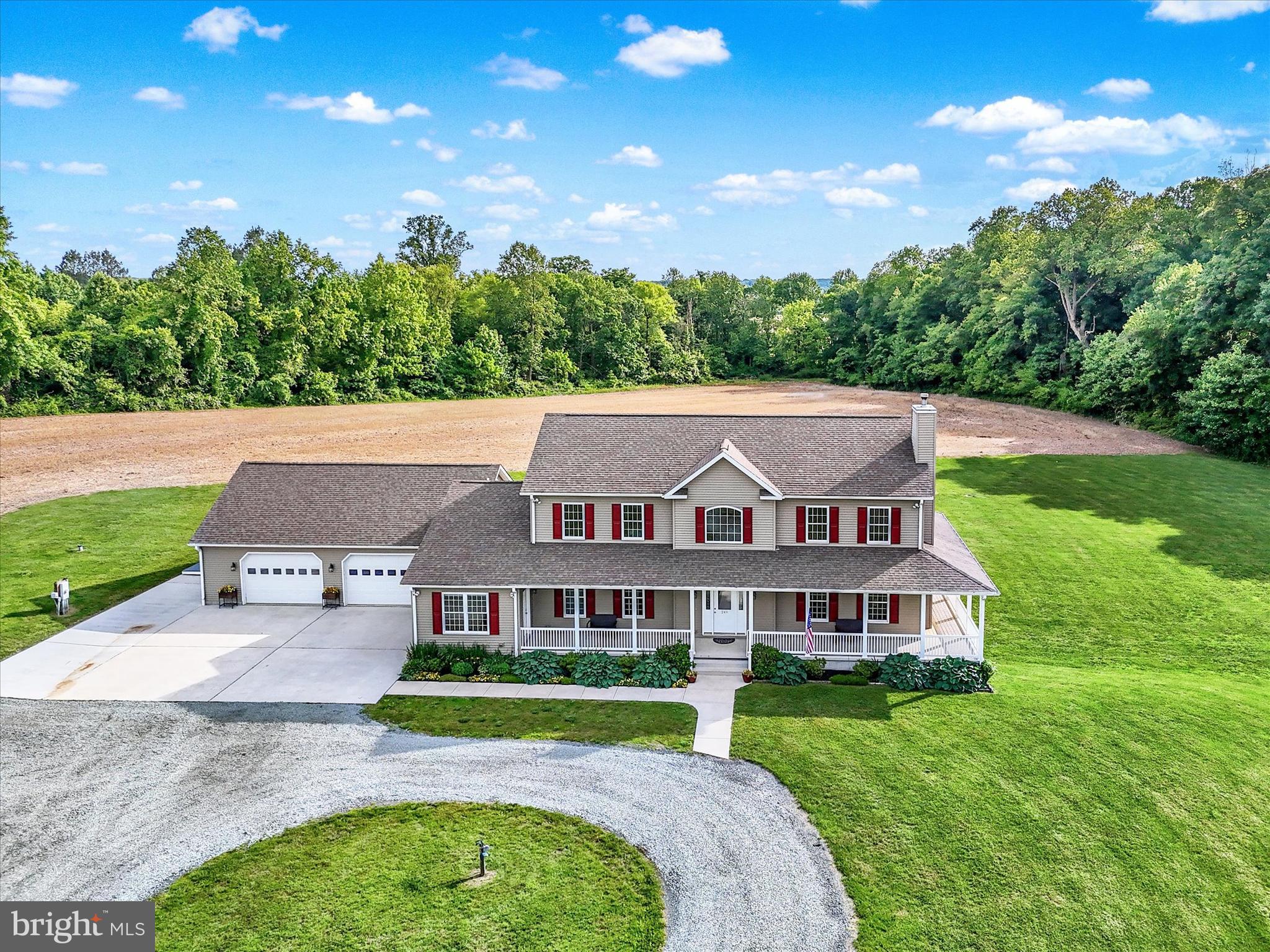 249 Floral Way Rising Sun, MD 21911 - Photo 5 of 65 a aerial view of a house next to a big yard and large trees