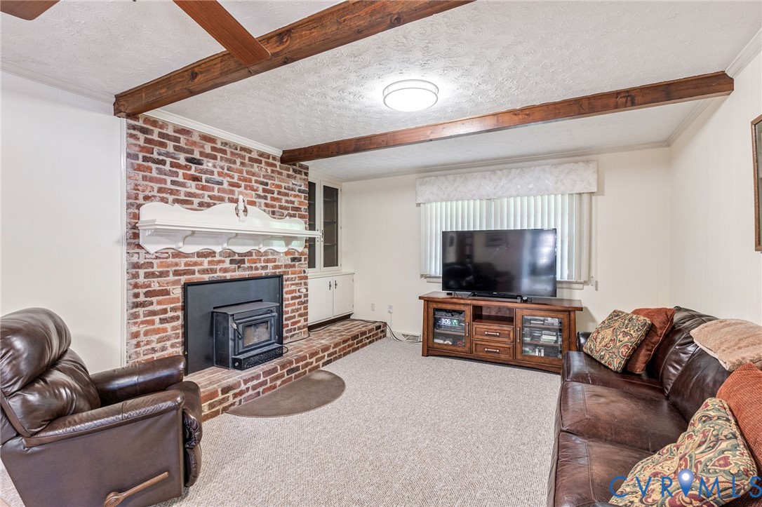 5700 Elfinwood Road Chester, VA 23831 - Photo 19 of 38 a living room with furniture and a flat screen tv