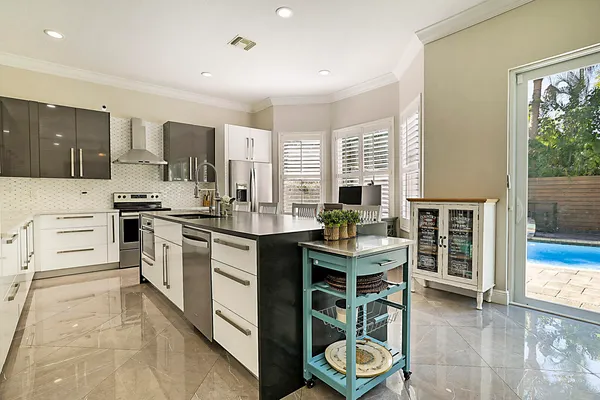 a kitchen with a sink stove and cabinets