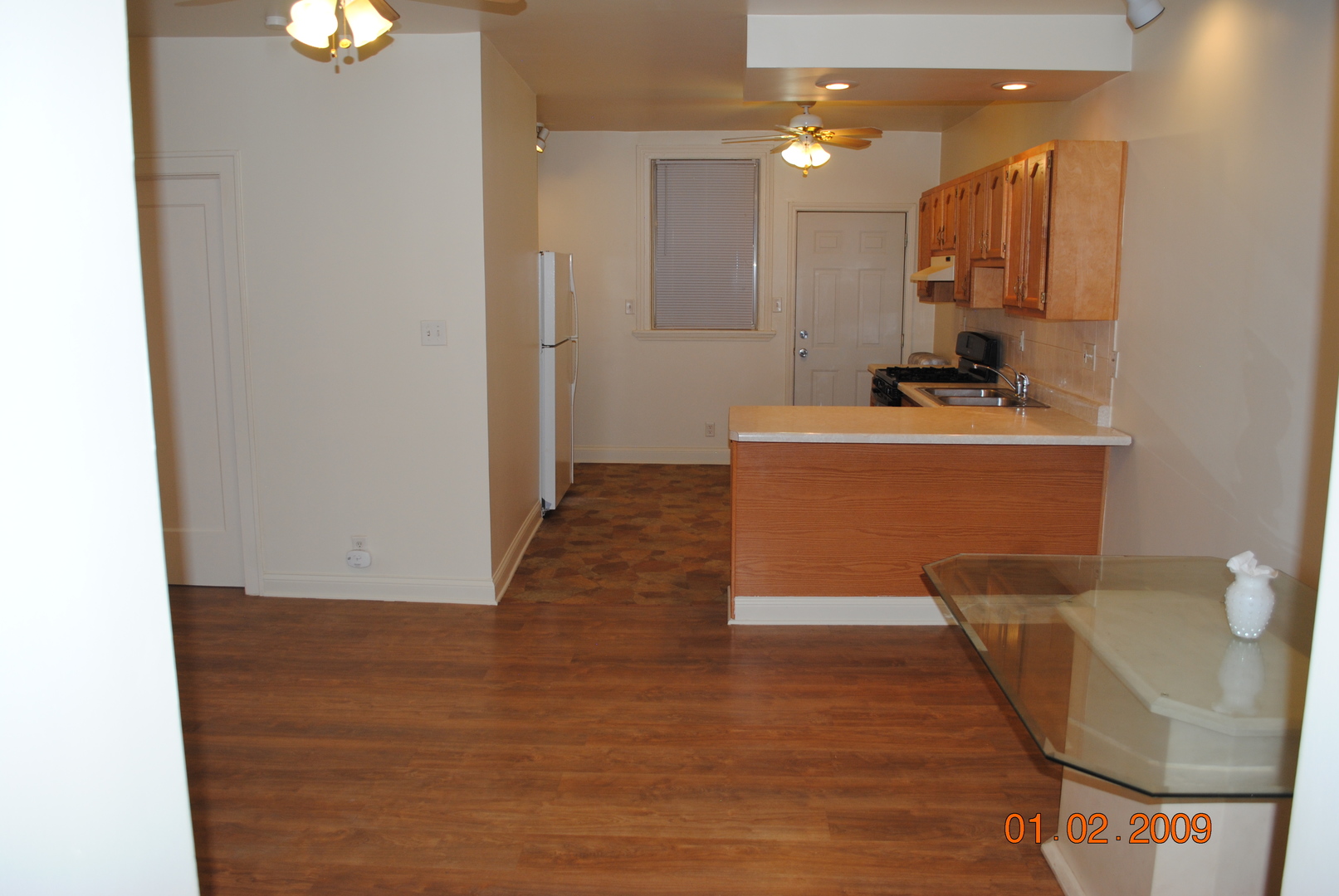 7635 South Yates Boulevard Chicago, IL 60649 - Photo 8 of 17 a view of a kitchen with a sink and a refrigerator