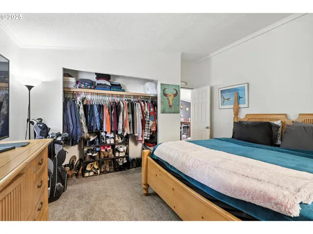 a bed room with a bed and a desk