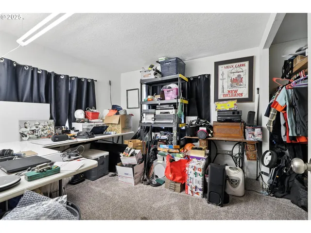 a living room filled with furniture and a gym machine