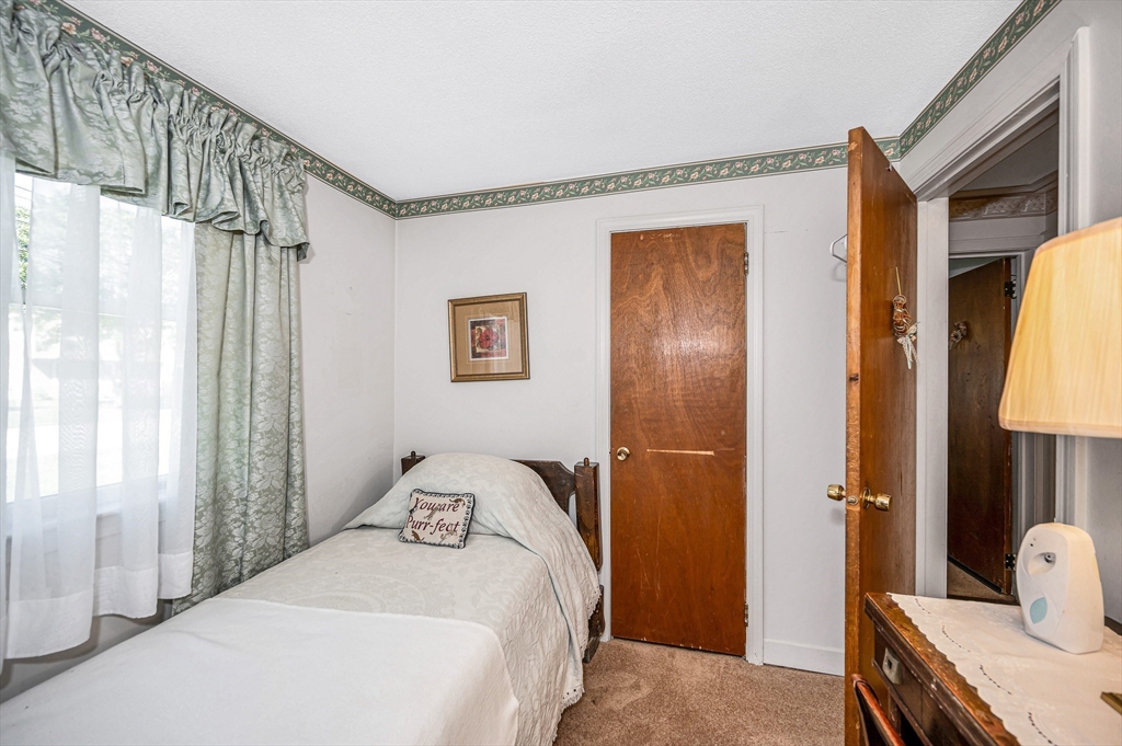 19 Reo Road Maynard, MA 01754 - Photo 17 of 41 a bedroom with a bed and a window