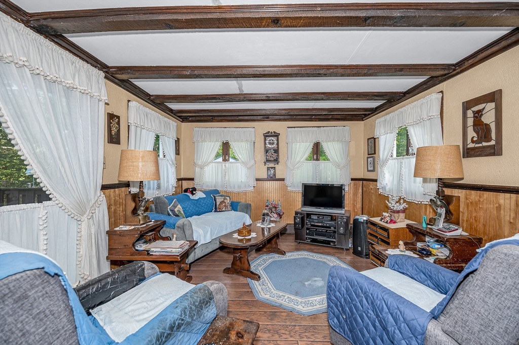 19 Reo Road Maynard, MA 01754 - Photo 19 of 41 a living room with furniture and a fireplace